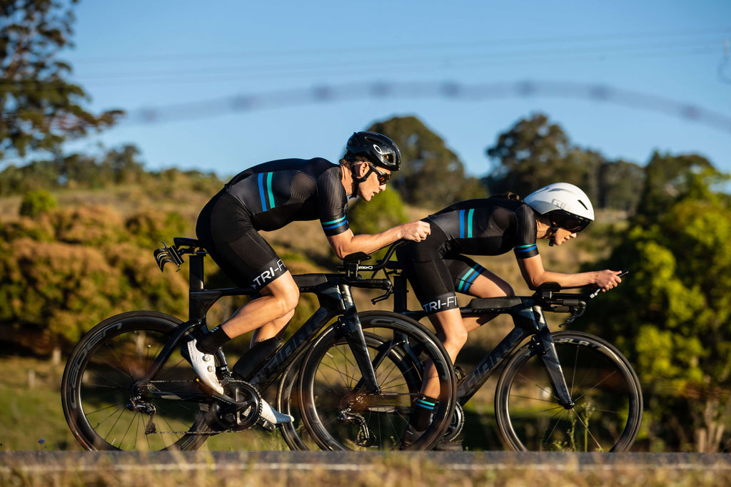 Man and woman cycling, showcasing the SYKL Pro range