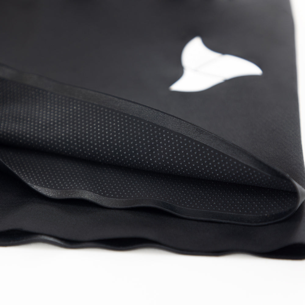 Close-up of printed silicone dot grippers on inner leg hem of VANGUARD tri-suit