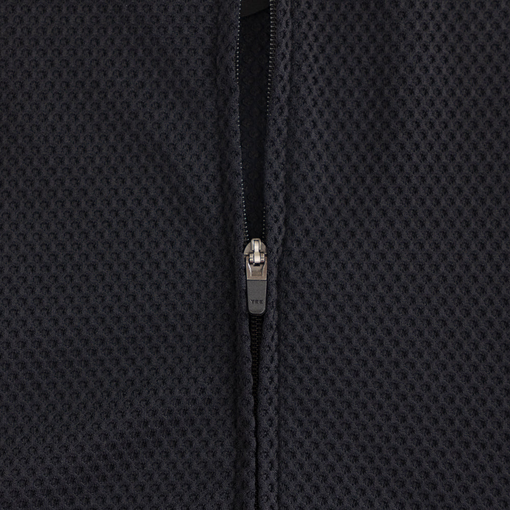 Detail of premium YKK zipper on TRI-FIT VANGUARD tri-suit front chest panel