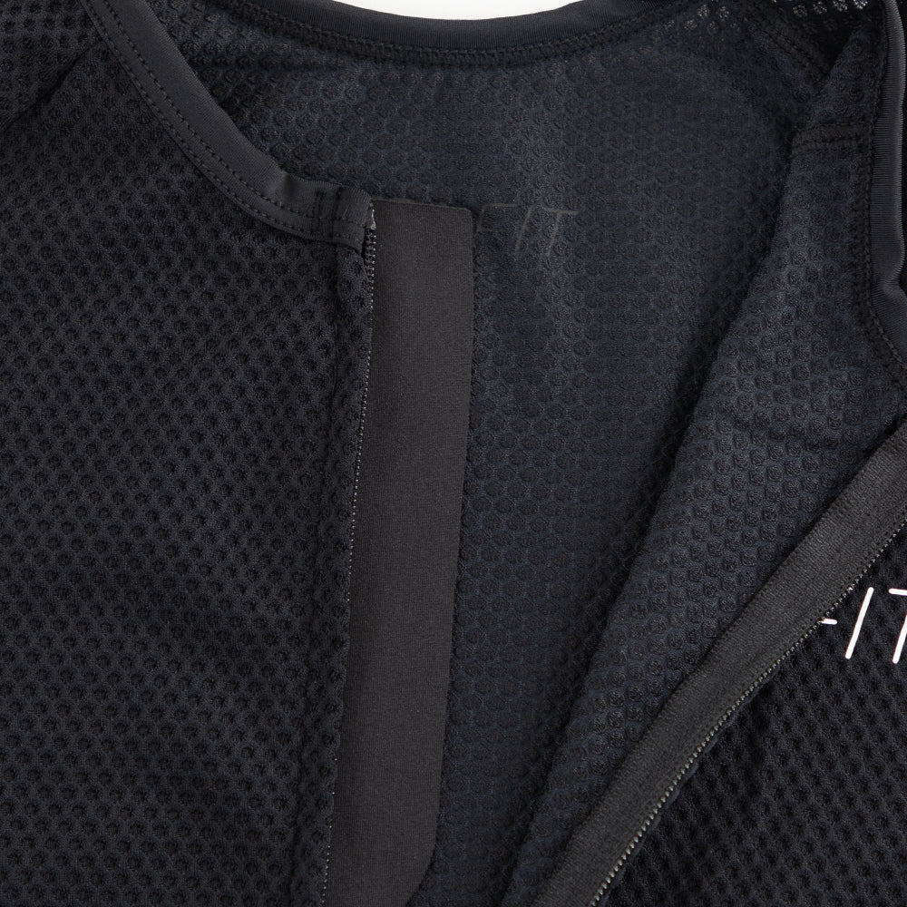 Close-up of TRI-FIT VANGUARD tri-suit neckline showing breathable mesh fabric and internal zipper construction